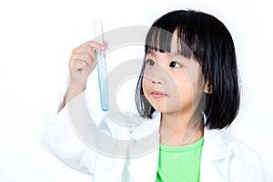 Smiling Asian Chinese Little Girl Examining Test Tube With Uniform