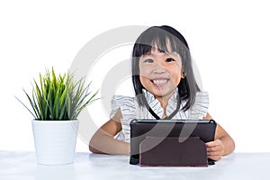 Smiling Asian Chinese little office lady with tablet
