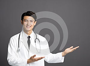 Smiling asian Doctor with stethoscope