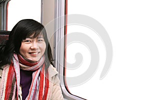 Smiling Asian Girl By Window