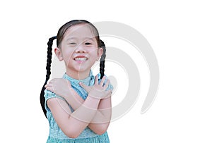 Smiling asian little child girl expression cross one`s arm and looking camera isolated on white background with copy space.