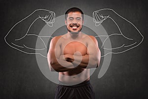 Smiling asian man with muscular upper body in front of muscle arms background. Fitness, workout and training concept