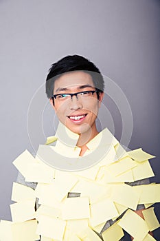 Smiling asian man pasted stickers