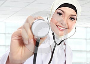Smiling asian medical doctor with stethoscope