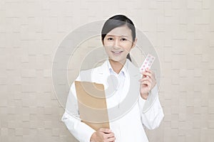 Smiling Asian pharmacist