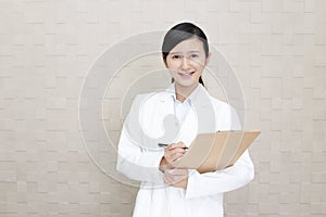 Smiling Asian pharmacist