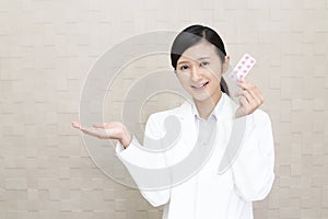 Smiling Asian pharmacist