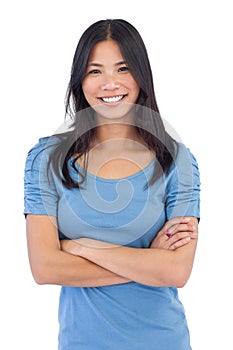 Smiling asian woman with arms crossed