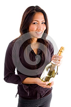 Smiling asian woman holding champagne bottle