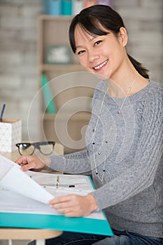 smiling asian woman in office