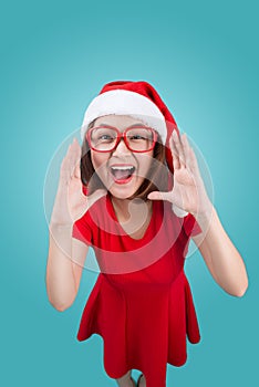 Smiling asian woman portrait with christmas santa hat shouting i