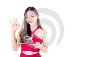 Smiling asian woman in red dress holding tablet with glad girl g