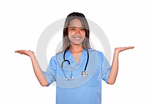 Smiling asiatic nurse woman holding out her palms