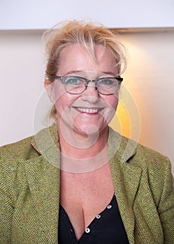 Smiling attractive middle-aged woman with glasses