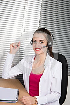 Smiling attractive woman with headphone smiling hands up