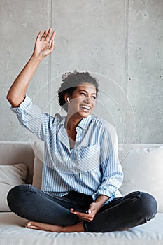 Smiling attractive young african woman wearing shirt