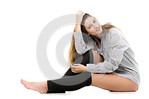 Smiling attractive young girl in shirt and gaiters photo