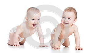 Smiling babies girl and boy crawling