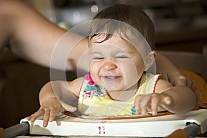 Smiling baby on baby chair