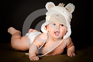 Smiling baby in bear cap