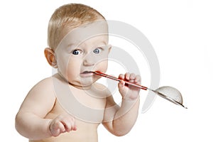 Smiling baby-boy in a diaper sitting on the floor. On a white background with reflection