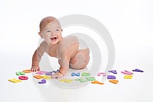 Smiling Baby Boy Playing with Alphabet Toys