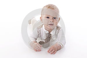 Smiling baby-boy in a romper suit crawling