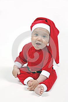 Smiling baby in Christmas suit