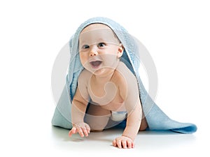 Smiling baby covered with a towel