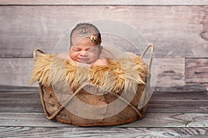 Smiling Baby Girl Sleeping in a Basket
