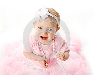 Smiling baby girl wearing pettiskirt tutu