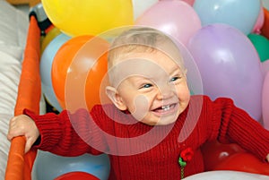 Smiling baby with globes