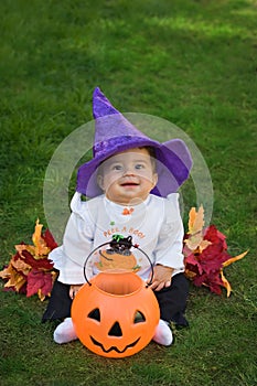 Smiling baby halloween witch