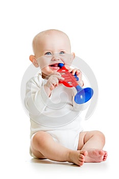Smiling baby playing with musical toy on white backgro