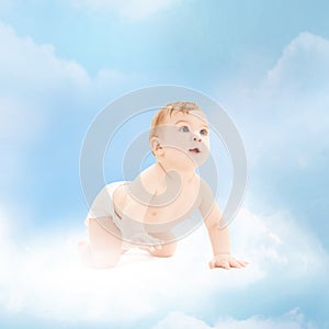 Smiling baby sitting on the cloud