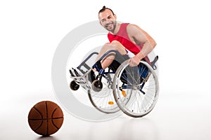 Smiling basketball player in wheelchair