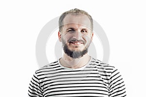 Smiling bearded adult man in a striped T-shirt. 30-35 years old. Isolated on white