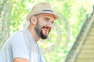 Smiling bearded man in a hat