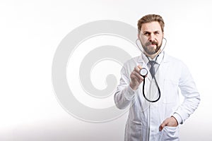 Smiling Bearded MD Posing With Stethoscope to Auscultate