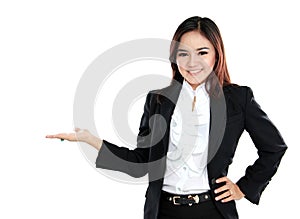 Smiling beautiful business woman presenting blank area