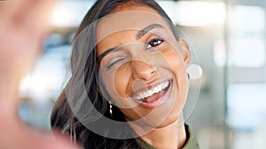 Smiling, beautiful and fresh female face winking feeling fun, silly and playful. Portrait of a happy woman head with