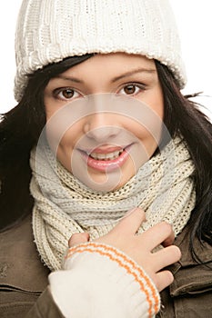 Smiling beautiful friendly young brunette woman wearing a winter