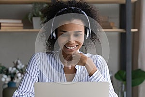 Smiling beautiful millennial african businesswoman holding video call.