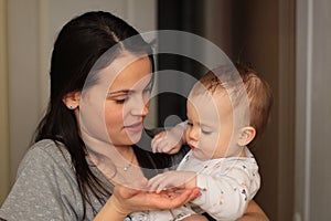 smiling beautiful mother with her baby