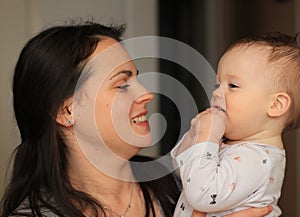 smiling beautiful mother with her baby