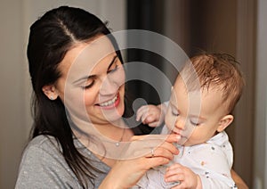 smiling beautiful mother with her baby