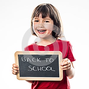 Smiling beautiful preschooler informing about cool back to school photo