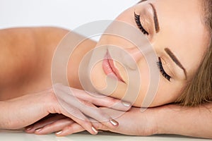 Smiling Beautiful Woman Eyes Closed or Sleeping Resting on Hands