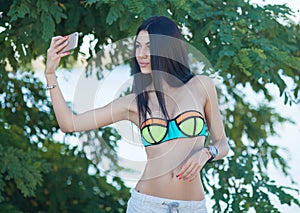 Smiling beautiful woman sunbathing on a beach. Focus on girl.