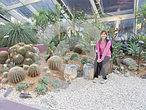 Smiling Beautiful Young Asian - Chinese Woman Traveling to Flower Dome, Garden by The Bay, Singapore